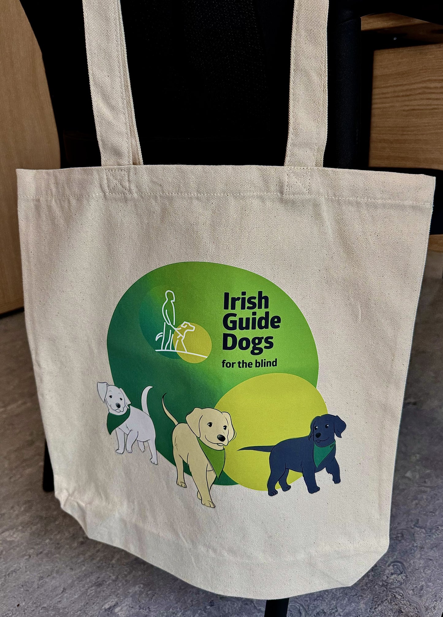 Irish Guide Dogs for the Blind canvas bag hanging on a chair.